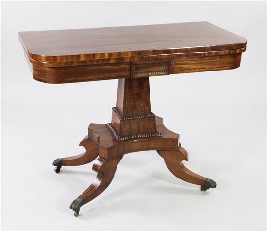 An early 19th century crossbanded mahogany folding card table, W.3ft 4.5in.